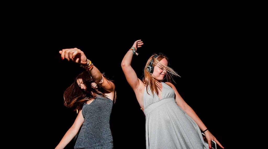 Guests dancing with light-up silent disco headphones